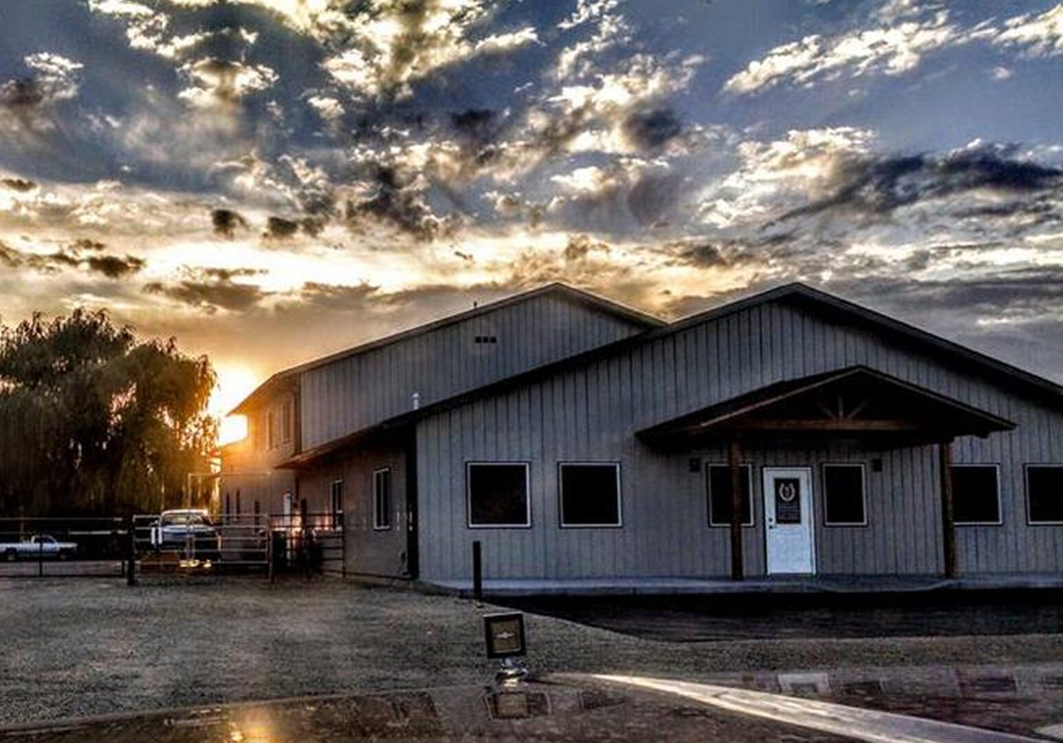 Sunset behind a building with dramatic sky.